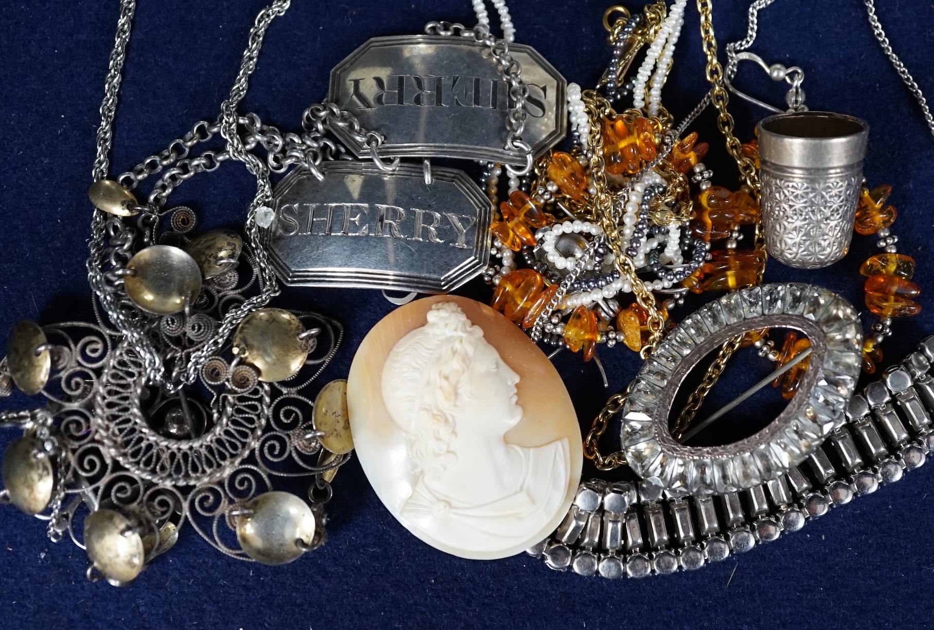 A small collection of assorted costume jewellery and other items including a paste set fringe necklace and brooch and two Georgian silver wine labels, London, 1818 and London 1828. Condition - poor to fair